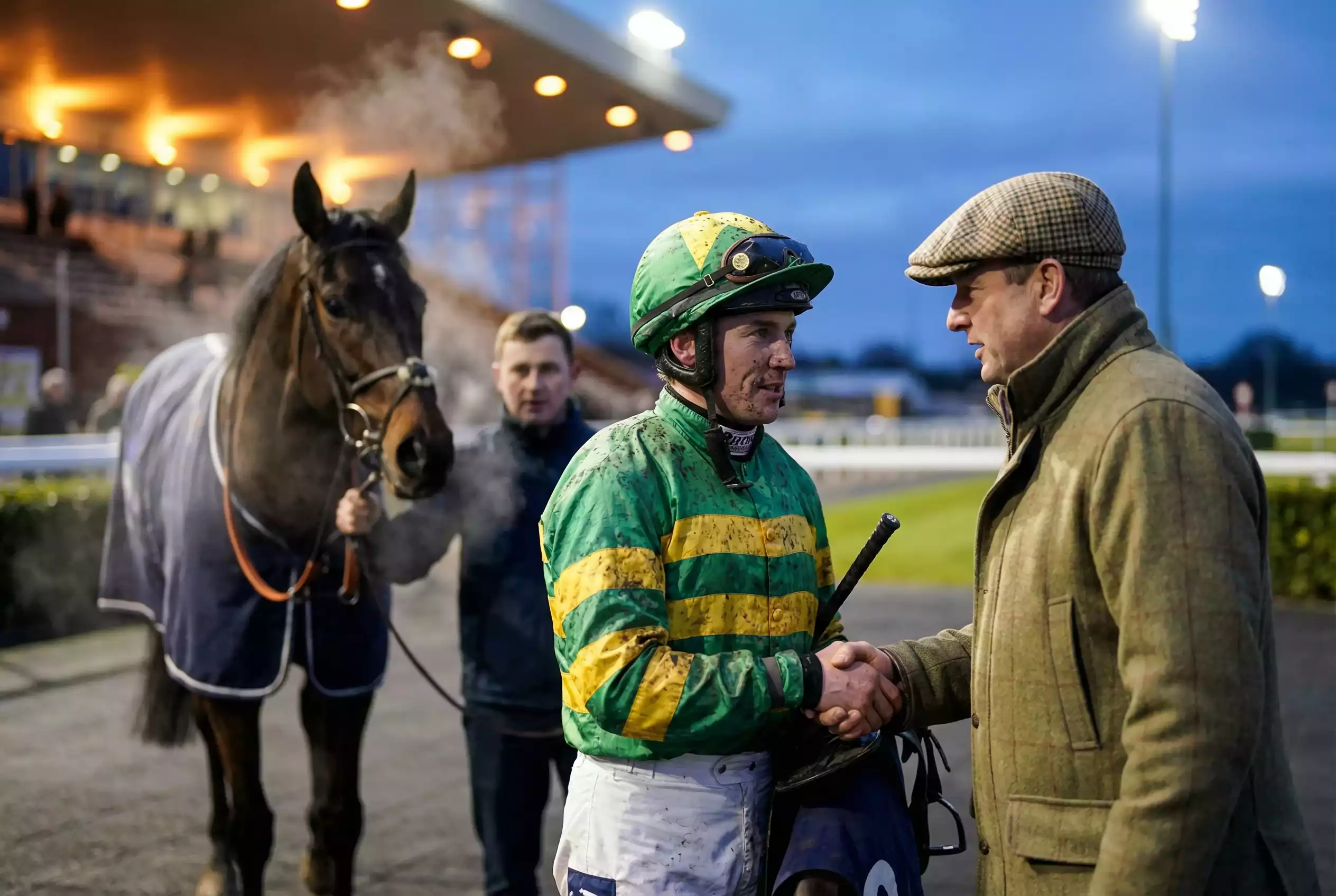 Jockey and trainer in the winners enclosure at Wolverhampton Dunstall Park after a race